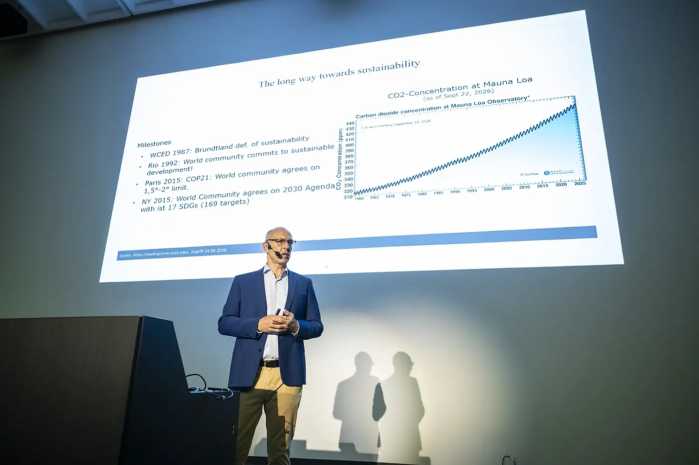 Speaker on stage at a scientific conference