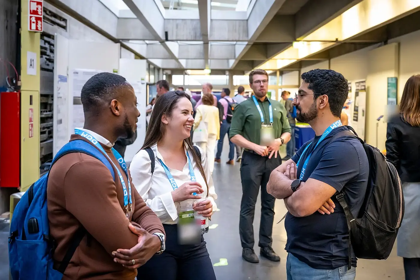 Participants talking in the poster exhibition