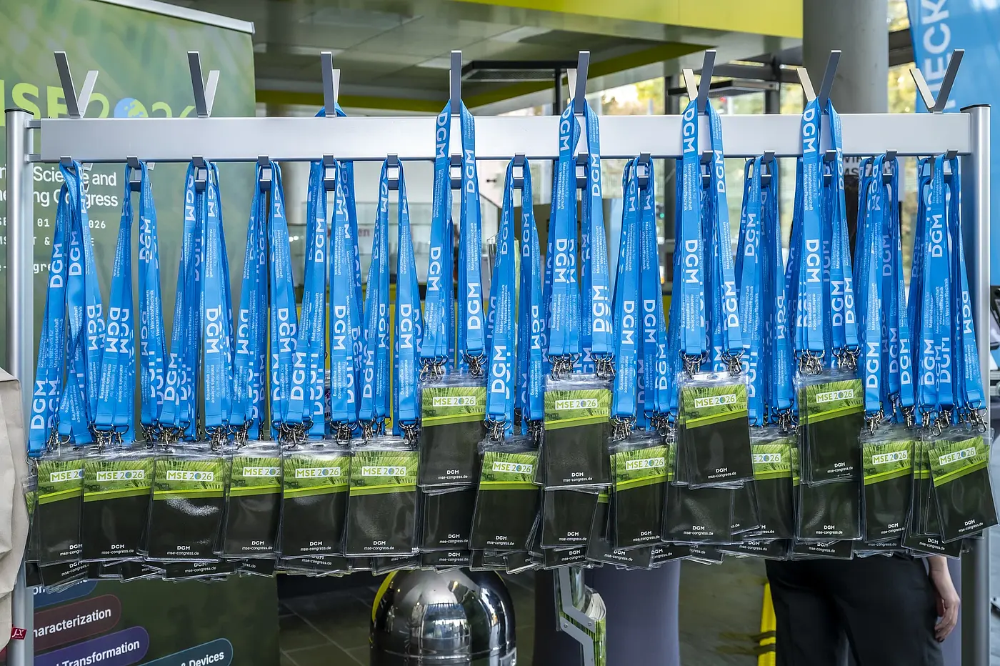 Prepared empty badge holders with blue DGM lanyards at MSE 2026